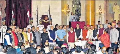  ?? ARVIND YADAV / HT PHOTO ?? President Pranab Mukherjee (11th from left) and Prime Minister Narendra Modi (12th from left) with 21 new ministers after Sunday’s swearing-in.