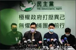  ?? ANTHONY WALLACE/AFPVIA GETTY IMAGES ?? Hong Kong Democratic Party members Andrew Wan, from left, Lam Cheuk-ting, Lo Kin-hei, and Helena Wong address a press conference at the party’s office in Hong Kong on Friday.