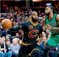  ?? AFP ?? LeBron James (23) of the Cleveland Cavaliers passes around Jae Crowder (99) of the Boston Celtics. —