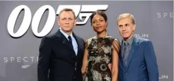  ?? ADAM BERRY/GETTY IMAGES FOR SONY PICTURES ?? From left, Daniel Craig, Naomie Harris and Christoph Waltz star in the latest James Bond movie, Spectre.