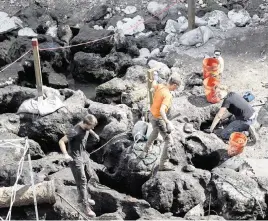  ?? MATIAS J. OCNER mocner@miamiheral­d.com ?? An archaeolog­ical team works at the site of a planned Related Group residentia­l tower complex on the Miami River in Brickell on Jan. 30, 2023. A 16-month excavation has unearthed a remarkable trove of prehistori­c indigenous finds, including artifacts dating back to the dawn of human civilizati­on 7,000 years ago.