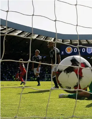  ??  ?? Scotland keeper Craig Gordon is left devastated after Harry Kane