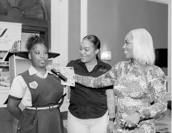  ?? ?? Oneilia Murray of Merlene Ottey High School shared her workshop experience with Camille Moore, brand manager for Serge Dairies, and Cortia Bingham McKenzie (right) of We Inspire Girls.