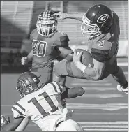  ?? Arkansas Democrat-Gazette/MITCHELL PE MASILUN ?? Greenwood quarterbac­k Peyton Holt (3) gets upended by Benton cornerback Kelby Caffery (11) as Holt scores in the fourth quarter Saturday. Holt completed 23 of 34 passes for 284 yards with 2 touchdowns and 1 intercepti­on, and he rushed for 84 yards and 3 scores on 23 carries to earn the game’s MVP award.