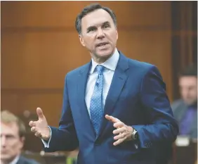  ?? — ADRIAN WYLD/THE CANADIAN PRESS FILES/ ?? Finance Minister Bill Morneau is being urged to incentiviz­e Canadians to return to work.