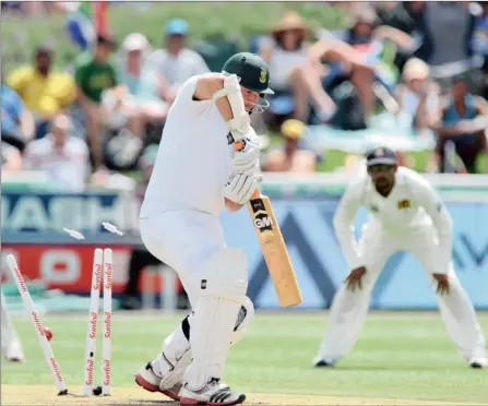  ?? PICTURE: GALLO IMAGES ?? CLEAN BOWLED: South African captain Graeme Smith loses his wicket to Dhammika Prasad of Sri Lanka for 16 runs during the opening day of the third Test at Newlands in Cape Town, today. At the time of going to press the Proteas were 93/2, with Hashim...