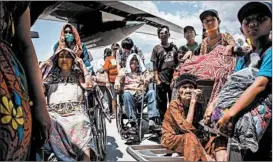  ?? ULET IFANSASTI/GETTY-AFP ?? The elderly wait to board an aircraft at the Palu airport, which reopened after a quake.