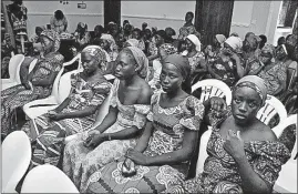  ?? [OLAMIKAN GBEMIGA/THE ASSOCIATED PRESS] ?? Chibok school girls recently freed from Boko Haram captivity visit Abuja, Nigeria, on Sunday to meet President Muhammadu Buhari.