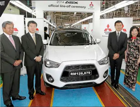  ??  ?? Mitsubishi officials (from left) Shiraji, Chokki, Oda and TCMA’s Tan presenting the lower-priced ASX.