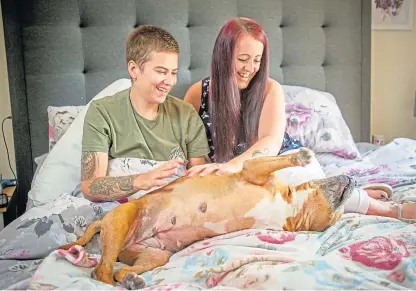  ?? Picture: Kim Cessford. ?? Kirsty Maxwell, left, and her fiancee Nadia Huggan with one of their dogs.