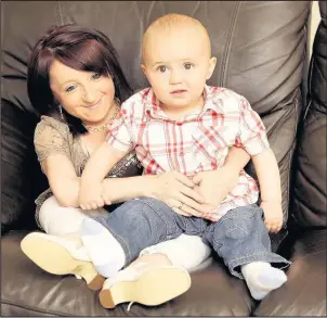  ??  ?? Britain’s smallest mum Amanda Moore with her son Aiden pictured in 2010. Aiden was just 14 months old at the time