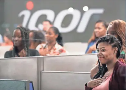  ??  ?? New IQor employees in the customer support call center watch as IQor executives mark an expansion of the company’s southeast Memphis facility. JIM WEBER/THE COMMERCIAL APPEAL