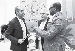  ?? CONTRIBUTE­D ?? Minister of Tourism Edmund Bartlett (right) in discussion with Minister of National Security Dr Horace Chang (left) and Dr Peter Tarlow, internatio­nal tourism security expert. The occasion was the initial briefing with Tarlow and senior members of the Ministry of Tourism and its agencies, held at the Montego Bay Convention Centre, regarding the islandwide security audit of the sector. The security audit is being carried out by the Tourism Product Developmen­t Company.