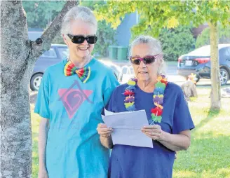  ?? Mark Furey ?? From left: Partners Wendy Annand and Alice Bent give a speech at this year’s Lunenburg Pride flag raising ceremony on July 17.