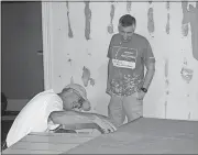  ?? Doug Walker / Rome News-Tribune ?? Phil Carter (left) and the Rev. Micah Pritchett of North Broad Baptist Church work on paneling at the youth center.