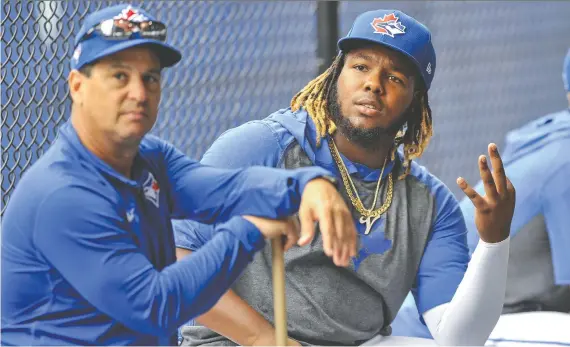  ?? STEVE NESIUS/THE CANADIAN PRESS/FILES ?? How manager Charlie Montoyo, left, uses his young stars, including Vladimir Guerrero Jr., could determine how the Jays fare over 60 games.