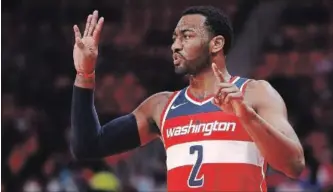  ?? GETTY IMAGES FILE PHOTO ?? Are the Washington Wizards a better team without John Wall in their lineup?