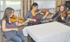  ?? ADAM MACINNIS/THE NEWS ?? Heather Cameron, Pam LeBlanc and Hayley MacLeod play their fiddles together. They are all going to be teaching at an upcoming camp at Sharon St. John United Church in Stellarton.