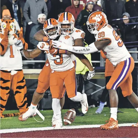  ?? BRIAN FLUHARTY/USA TODAY SPORTS ?? Clemson wide receiver Amari Rodgers (3) celebrates with teammates after scoring a TD on a punt return against Boston College.