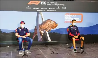  ??  ?? Red Bull’s Dutch driver Max Verstappen (left) and Red Bull’s Thai driver Alex Albon, both wearing protective face mask and observing social distancing, at the driver’s press conference.