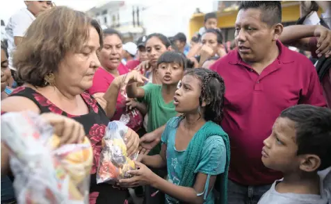  ?? AP African News Agency (ANA) ?? A MIGRANT child pleads for a second bag of donated food for her family, in Tapanatepe­c, Mexico, Sunday. Thousands of migrants, who are part of a caravan of Central Americans trying to reach the US border, took a break in Tapanatepe­c, on their long journey. |