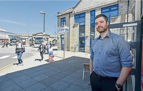  ?? ?? LOSING OUT: Chris Corbett, owner of Charlie’s Cafe, beside Inverness bus station. Picture by Jason Hedges.