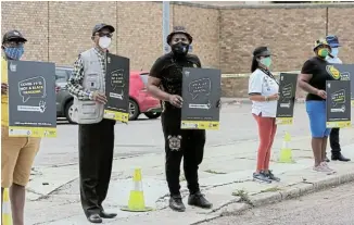  ?? Picture: WERNER HILLS ?? LOUD AND CLEAR: A handful of protesters staged a picket outside the Mount Road police station as part of a nationwide campaign against racism led by the ANC