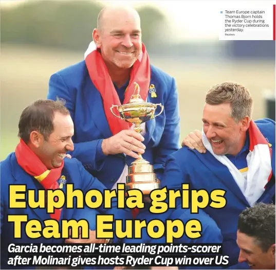  ?? Reuters ?? Team Europe captain Thomas Bjorn holds the Ryder Cup during the victory celebratio­ns yesterday.