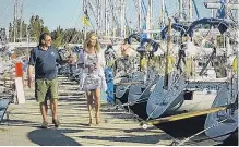  ?? PHOTO: TVNZ. ?? Shooting the breeze . . . Former Dunedin man Barrie Neilson shows Hilary Timmins some of his flotilla of yachts at berth in Corfu.