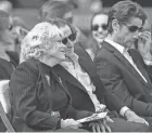  ?? ?? Carol Martin sits in the front row for the celebratio­n of life for her husband, legendary Florida State baseball coach Mike Martin on Feb. 10.