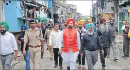  ??  ?? ■ National Commission for Minorities member Manjit Singh Rai (centre) during his visit to the Sweeper Colony in Shillong on Wednesday. HT PHOTO