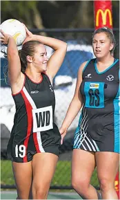  ?? Photograph­s by
CRAIG JOHNSON. ?? Right: Warragul young gun Pippa Cook is all smiles after a turnover, as Wonthaggi’s Chelsea Bowman watches during A grade.