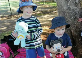  ??  ?? Asher Miller (left) and Zachary Smith hug their teddies.