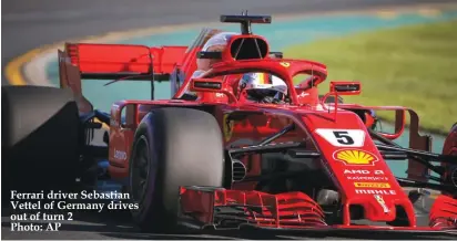  ??  ?? Ferrari driver Sebastian Vettel of Germany drives out of turn 2 Photo: AP