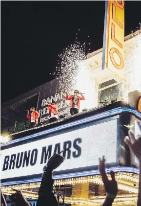  ?? CBS ?? Bruno Mars performed on the Apollo Theater marquee while recording his television special.