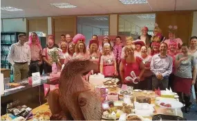  ??  ?? Thinking pink Staff at Tilhill Forestry who raised £2,330 for Breast Cancer Now