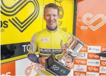  ?? PHOTO: JAMES JUBB/STUDIO JUBB ?? Trophy time . . . PowerNet rider Aaron Gate enjoys the spoils of victory after winning the Tour of Southland in Invercargi­ll on Saturday.