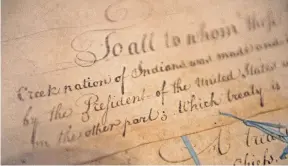  ?? [ASSOCIATED PRESS FILE PHOTO] ?? The 1790 Treaty of the Muscogee (Creek) Nations and the United States is shown on display at the Smithsonia­n’s National Museum of the American Indian in Washington in 2015. It’s one of a series of treaties between the Nations and the U.S. government. The Supreme Court declared this past week that much of Tulsa and eastern Oklahoma have long been a reservatio­n of the Muscogee (Creek) Nation.