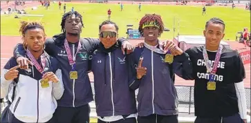  ?? Cheree Davis ?? COACH DAY LYRIC stands in the middle of his high-flying Upland hurdlers, from left, DeQuan January Jr., Delaney Crawford, Kai Graves-Blanks and Davis Davis-Lyric. The quartet seeks a sweep in 110-meter finals.