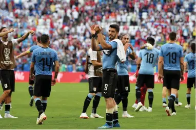  ??  ?? EXPLOSIVE OPENER: Luis Suarez, who scored Uruguay’s first goal against Russia, acknowledg­es the team’s supporters after the match.