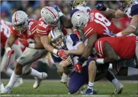  ?? MARK J. TERRILL — THE ASSOCIATED PRESS ?? Washington quarterbac­k Jake Browning is sacked during the second half of the Rose Bowl on Jan. 1 in Pasadena, Calif.