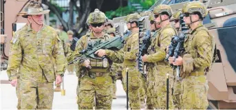  ?? HANDOVER: Commander 3rd Brigade Brigadier Scott Winter inspects yesterday’s parade. ??