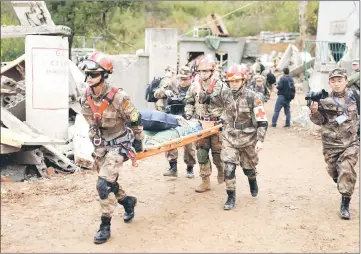  ??  ?? US Army and China’s PLA military personnel taking part in the disaster relief drills near Nanjing, Jiangsu province, China. — Reuters photos