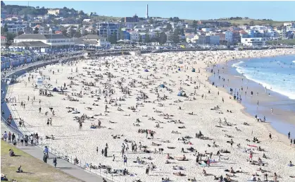  ??  ?? COVID-safe crowd control measures will be brought in this summer to prevent overcrowdi­ng at beaches, including Bondi.