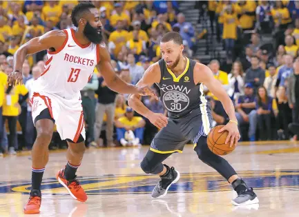  ?? AP-Yonhap ?? Golden State Warriors’ Stephen Curry, right, is defended by Houston Rockets’ James Harden during the second half in Game 4 of the NBA basketball Western Conference Finals in Oakland, Calif, Tuesday.