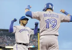  ?? BEN MARGOT / THE ASSOCIATED PRESS FILES ?? Jays fans are eager to see what happens with free-agent sluggers Edwin Encarnacio­n, left, and Jose Bautista.