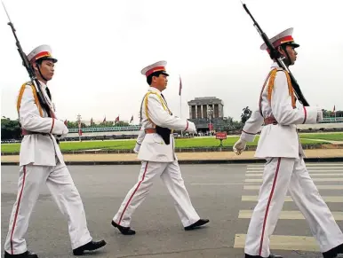  ??  ?? QUICK STEP: Soldiers march past the late Vietnamese president Ho Chi Minh’s mausoleum in Hanoi