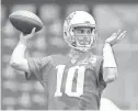  ??  ?? Patriots quarterbac­k Jimmy Garoppolo (10) is expected to start the season’s first four games, including the opener vs. the Cardinals, in place of the suspended Tom Brady.