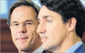  ?? CP PHOTO ?? Mark Rutte, left, Prime Minister of the Netherland­s, and Prime Minister Justin Trudeau hold a joint press conference on Parliament Hill in Ottawa on Thursday.