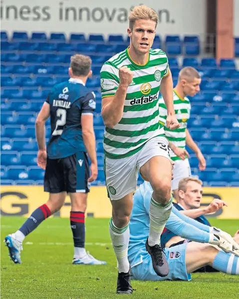  ??  ?? Kristoffer Ajer is jubilant after making it 4-0 to Celtic